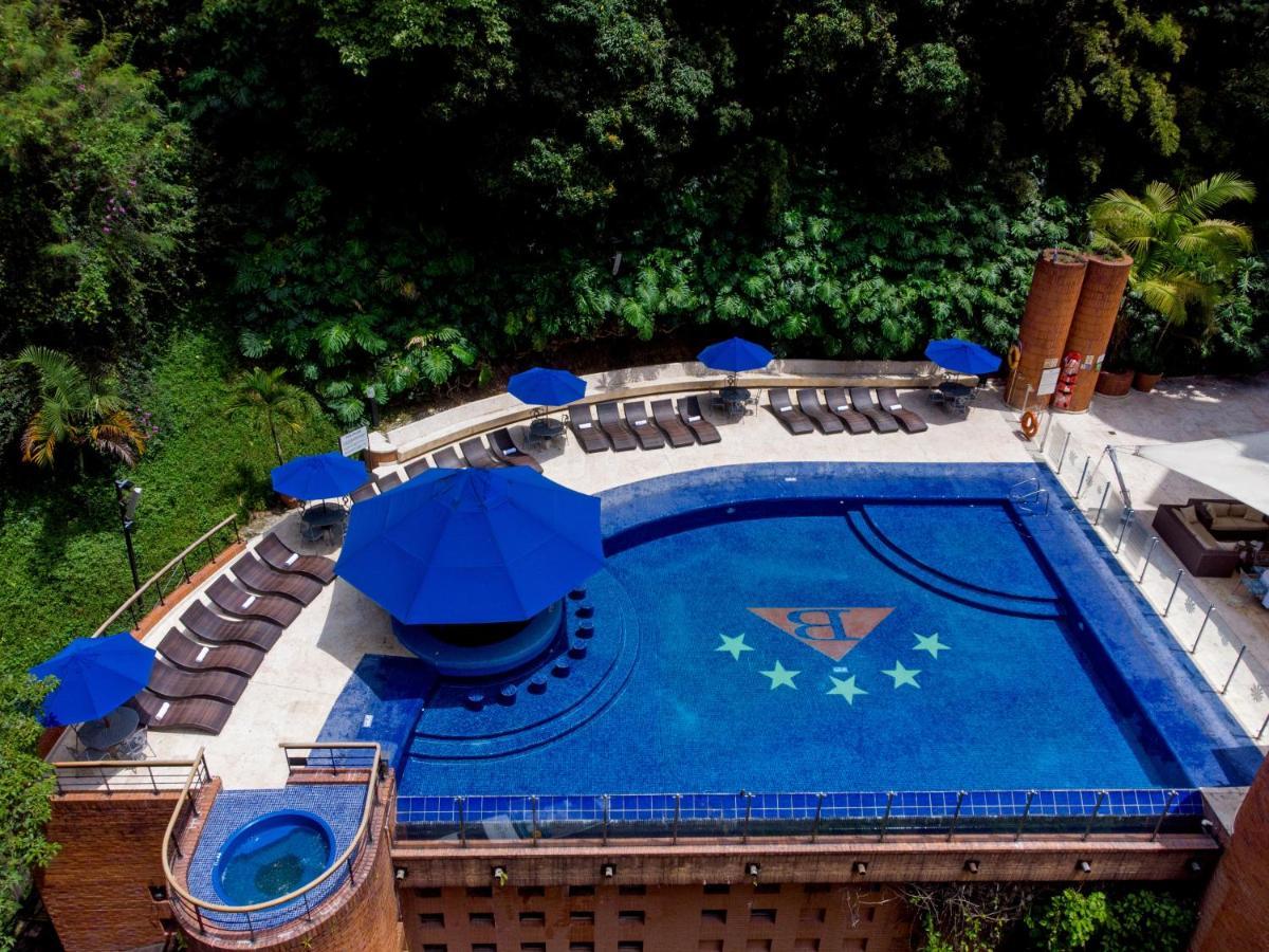 Hotel Dann Carlton Belfort Medellín Exterior foto The swimming pool at the hotel